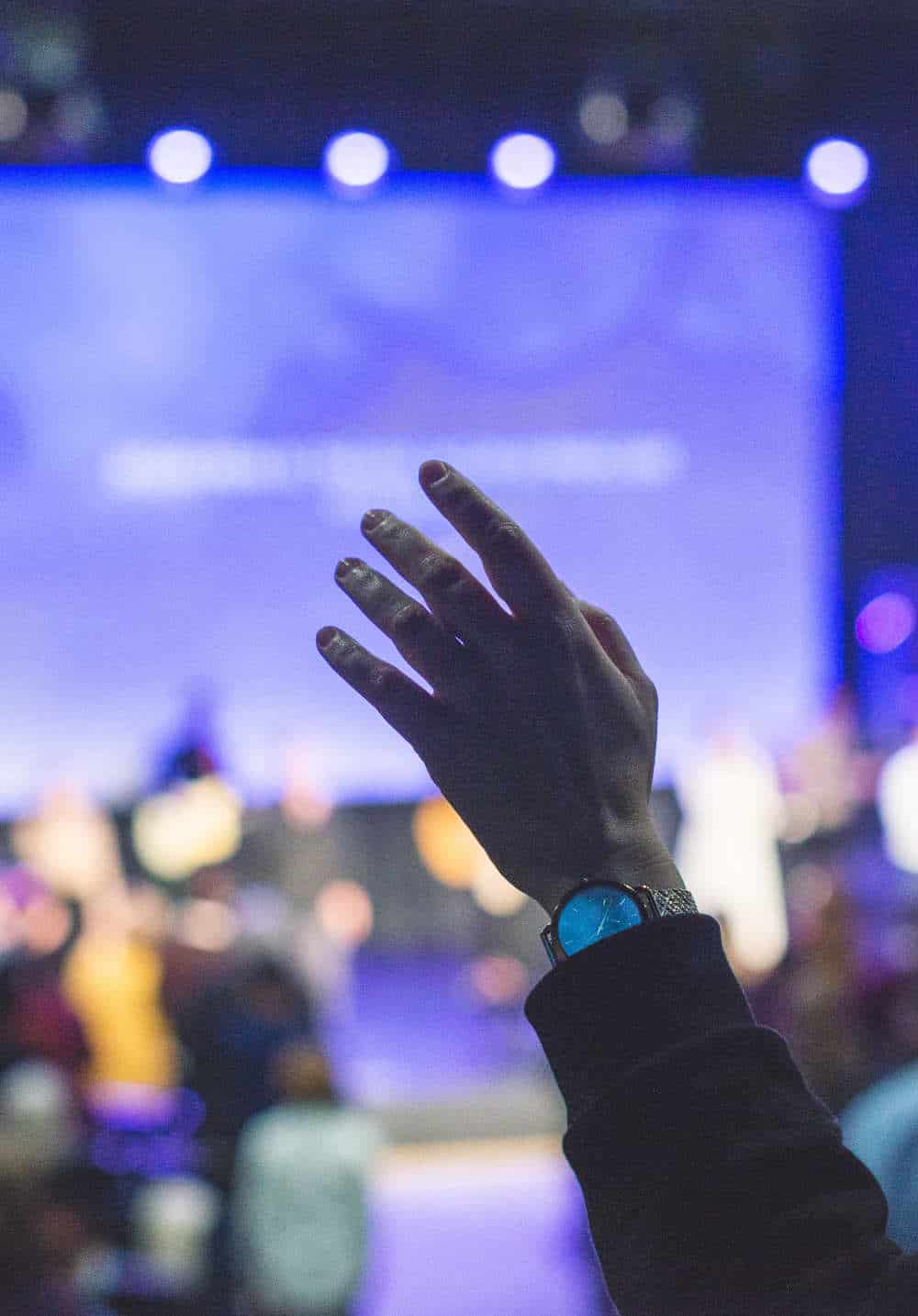 Worship Service with Raised Hand in Praise Worship Service with Raised Hand in Praise